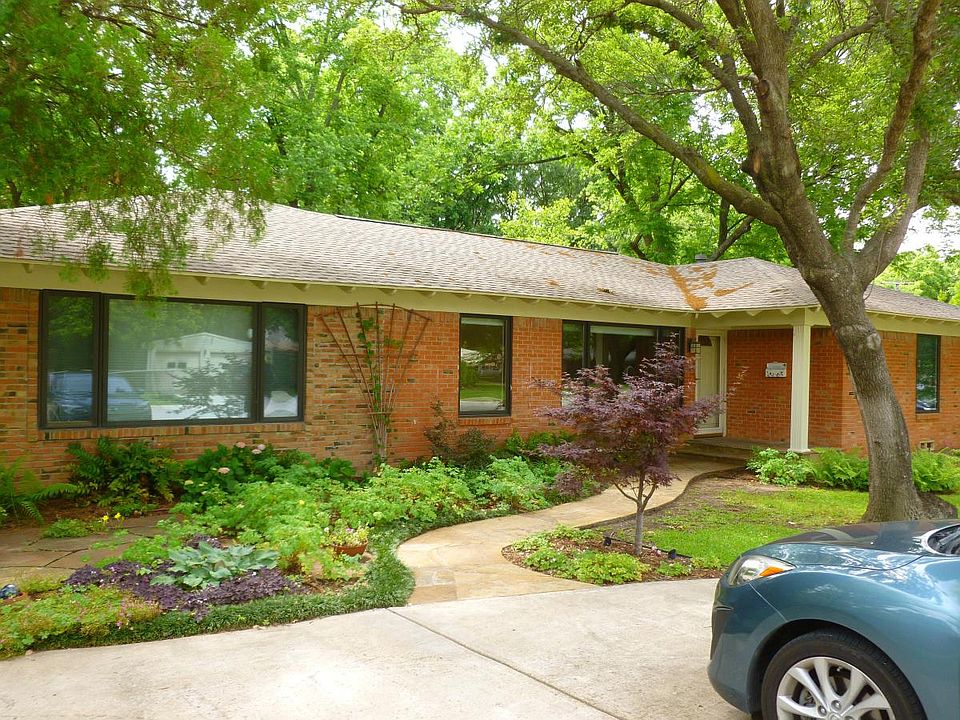 Front of the house with parking for 2 spots