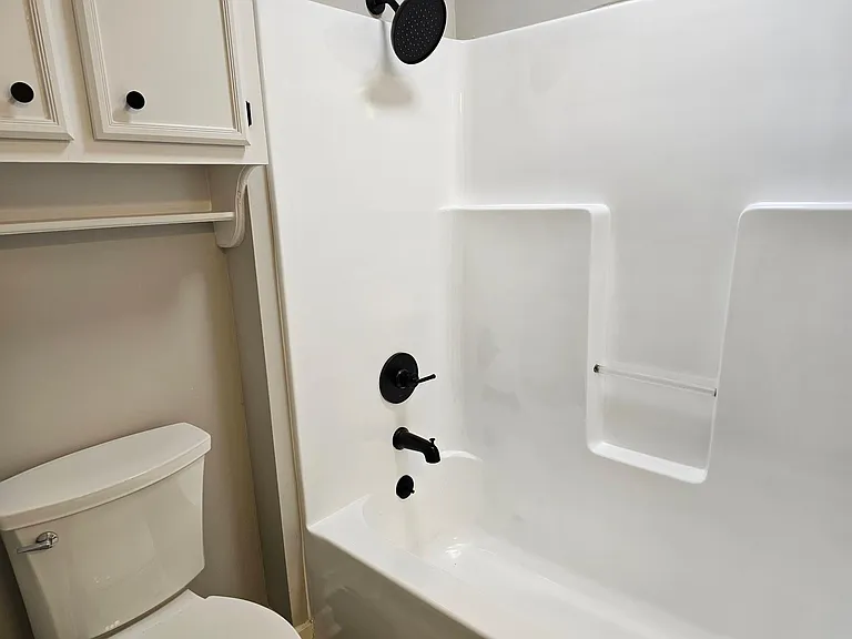 hall bath with resurfaced shower/tub