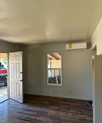 This is the front door leading into the living room with its own mini split heating and air conditioning unit