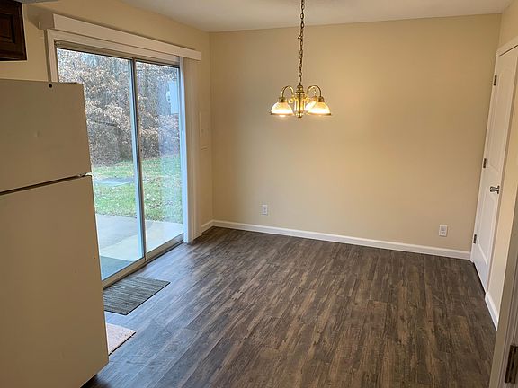 Dining area from kitchen, vertical blinds opened
