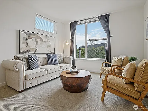 Fresh paint and carpet and east-facing windows create a light, airy space in the morning.
