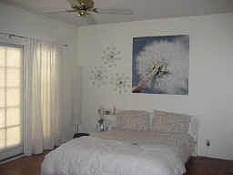 Roomy master bedroom with private patio