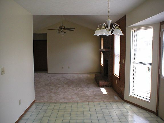 Looking from the kitchen, thru the dining area and into the large living room.