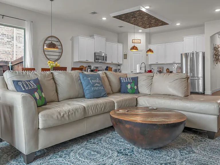 Genuine leather sofa and lounge set with unique modern farmhouse decor throughout the home.
