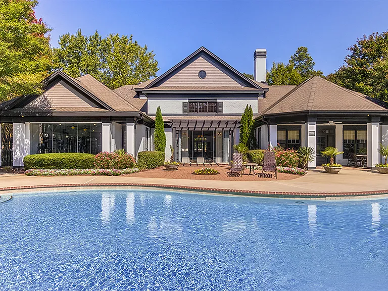 Saltwater swimming pool with cabana and grillsalong with plenty of lounging space
