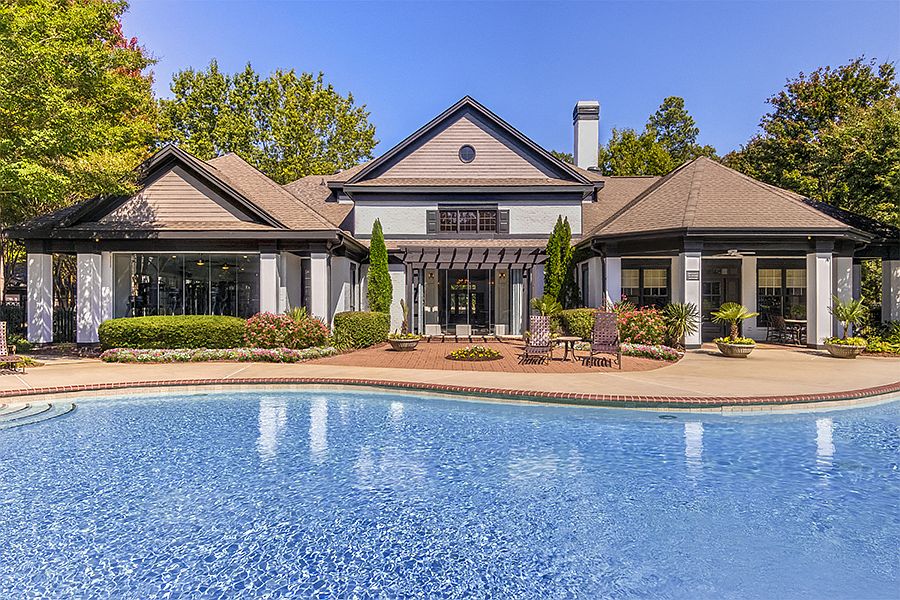 Saltwater swimming pool with cabana and grillsalong with plenty of lounging space