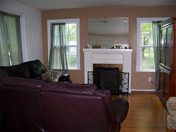 Another view of the living room. Notice the beautiful original hardwood floors!