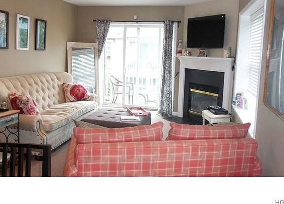 Living room w/gas fireplace and SGD to deck