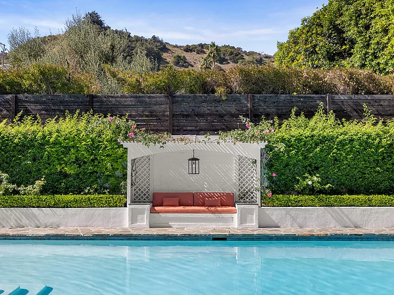 Daytime allure with poolside cabana and lush greenery_an exclusive retreat for ultimate relaxation.