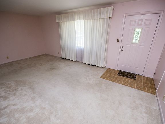 The front entry door leads into this open living room  (21x12) with a bay window view of the front yard.