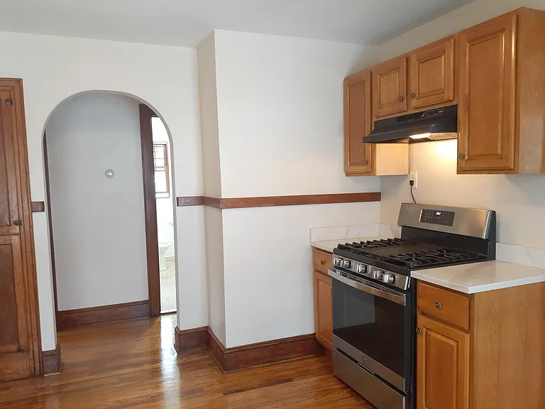 archway to bedrooms from kitchen