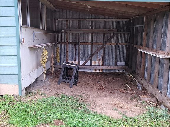 covered lean-to parking or storage attached to the 2nd detached outbbuilding.