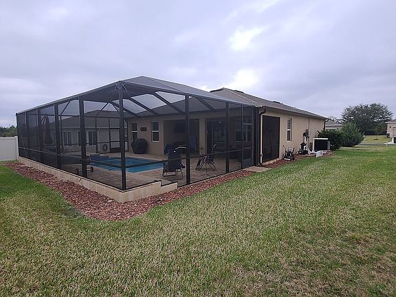 Screen cage over pool   