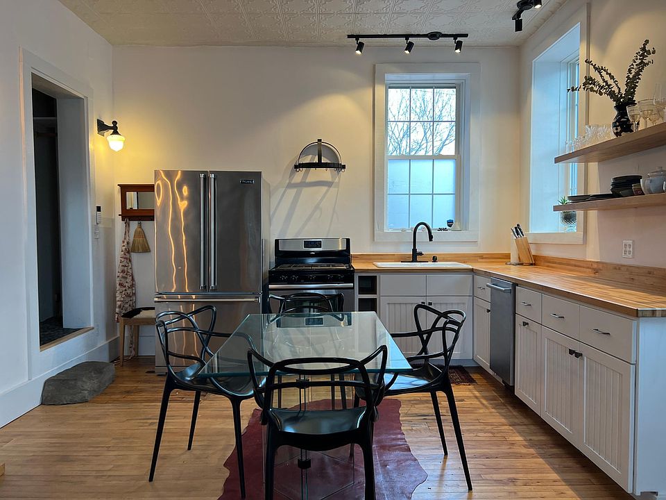 Kitchen, with 11' ceilings and butcher-block countertops.