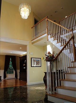 ONE OF TWO STAIRCASES THAT LEADS TO UPSTAIRS; MARBLE EF.