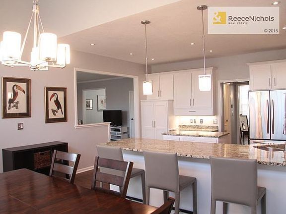 Island Kitchen with Breakfast Bar. Cabinets & granite counters galore!