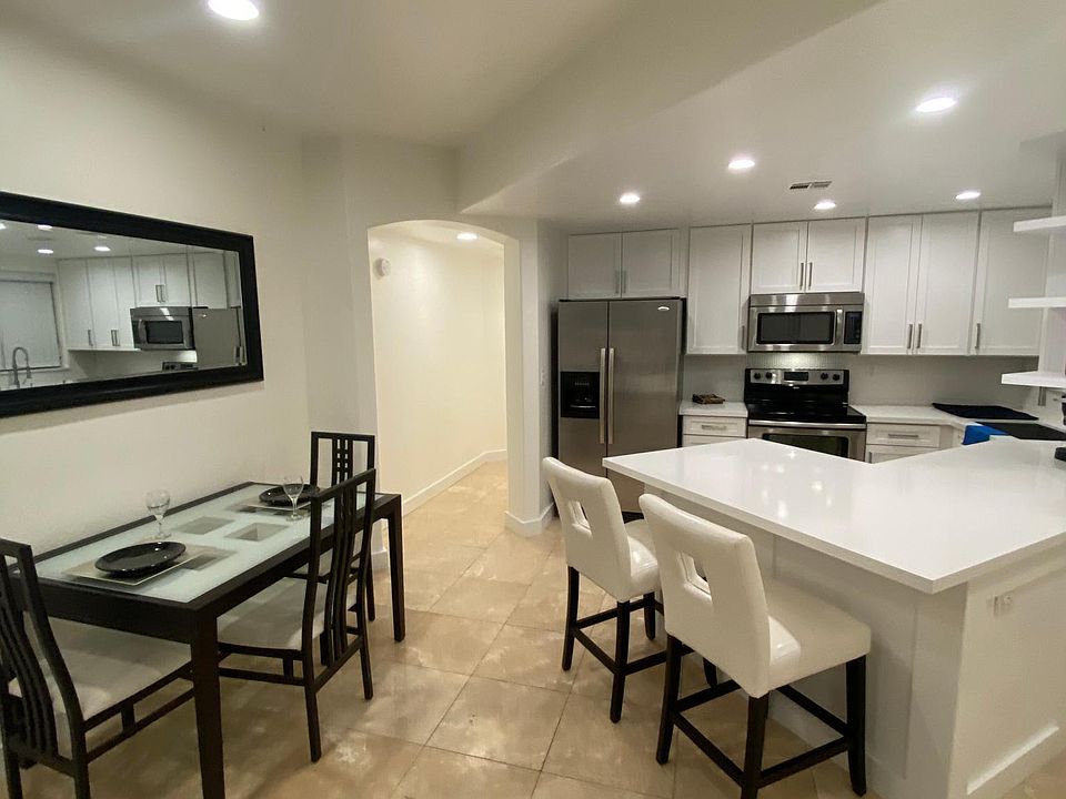 A view from the living room into the Kitchen and Dining area.
