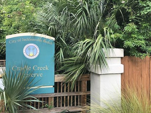 Park with trails and boardwalk to intracoastal a block away.
