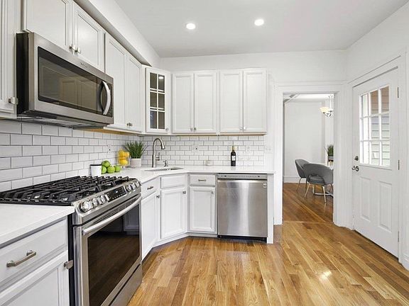 Kitchen with new appliances and island with seating (not shown)