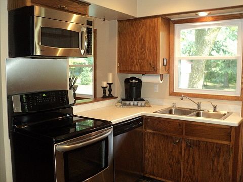 Kitchen With Stainless Steel Appliances/ Corian Countertops