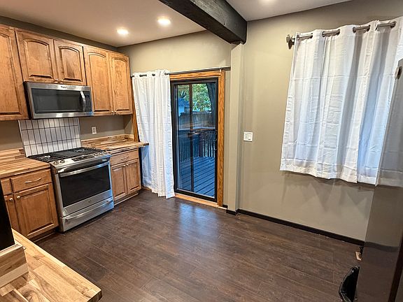 spacious kitchen that leads to the deck