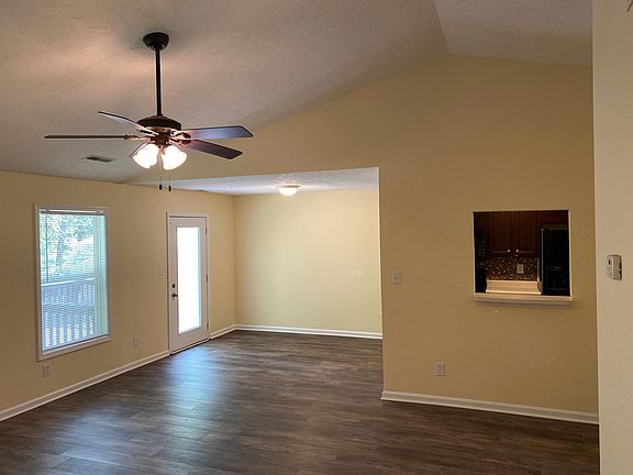 family room with vaulted ceiling