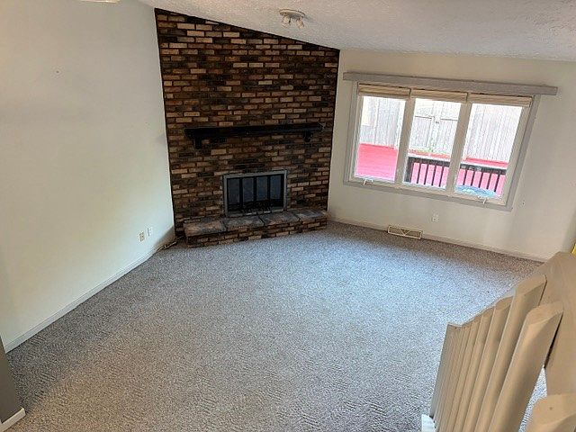 Vaulted Ceiling, brick wall Fireplace