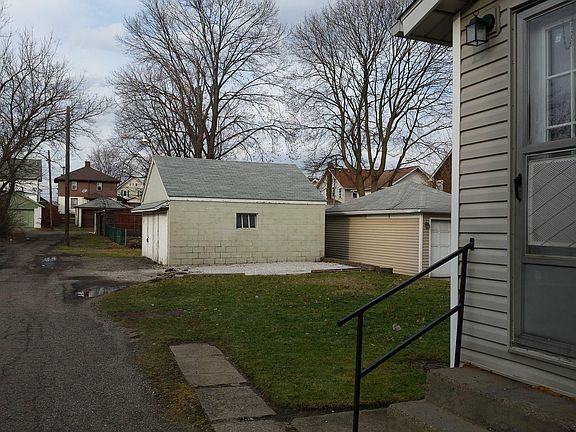 Backyard, parking space and garage