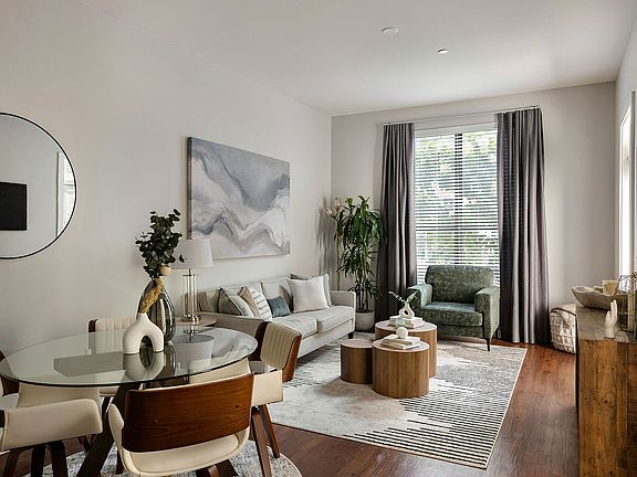 Spacious living room with hardwood-style flooring
