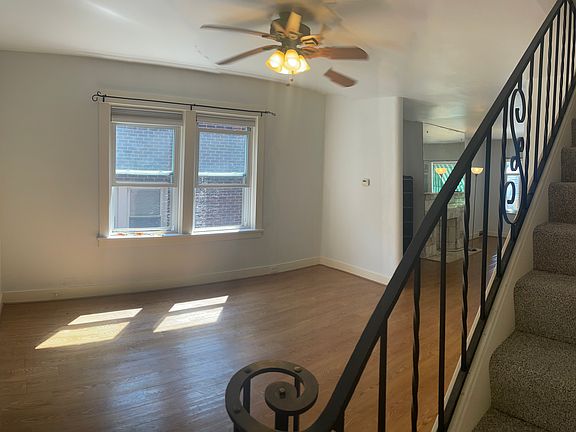 Dining Room &wrought iron bannisters staircase, looking to living room.