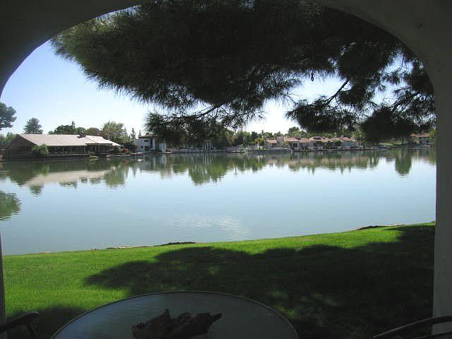View from patio of first floor gated condo in The Lakes