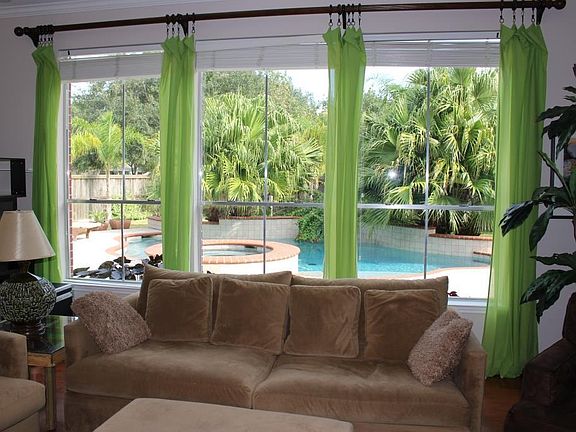 There is a wall of windows for a great view of the pool.