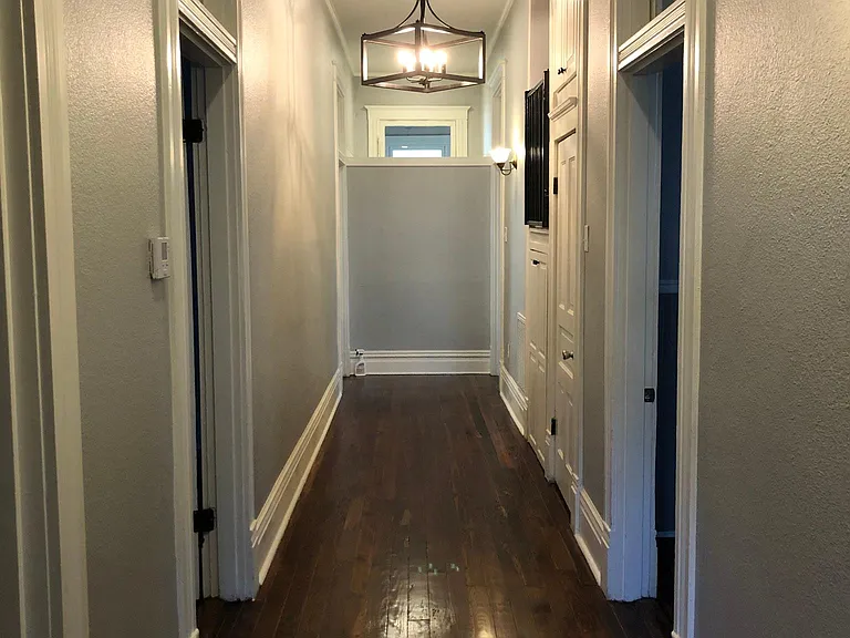 Beautiful oversized hallway with 2 bedrooms on main level, each with their own full bathroom.