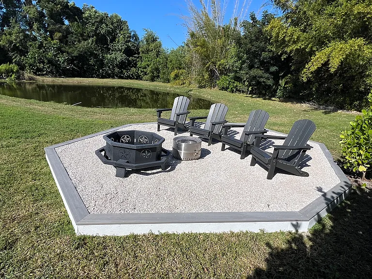 Raised firepit in back of pool area