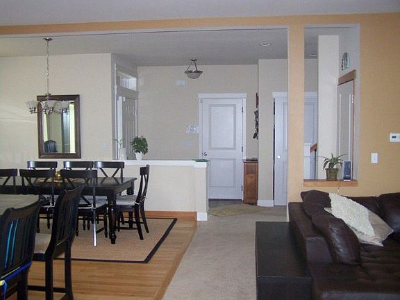 Entrance foyer opens to dining room, kitchen & family room.