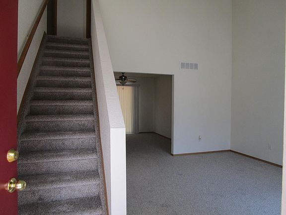 Front Entry, Stairs to upstairs, Living Room heading to Dining Room