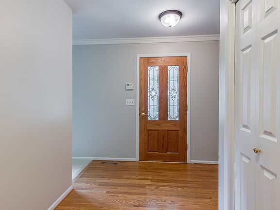 Hardwood floors greet you at the front entryway.  White trim and new light fixtures are just a few updates you will enjoy in this beautiful home.