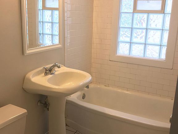 remodeled bath, linen closet in hall.