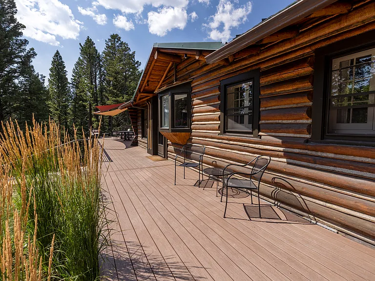 Deck walkway connected to middle parking area. Perfect for unloading groceries and getting firewood