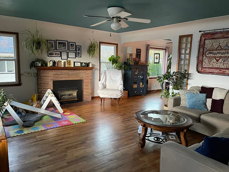 Coved plaster ceilings and restored hardwood floors.