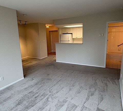 Living room, dining area, kitchen, front entrance, and 2nd bathroom view.