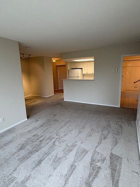 Living room, dining area, kitchen, front entrance, and 2nd bathroom view.