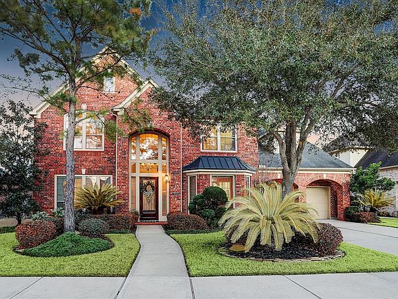 Enter the home through the leaded glass front door and 2nd story full of windows that lets in an abundance of natural light into the house.