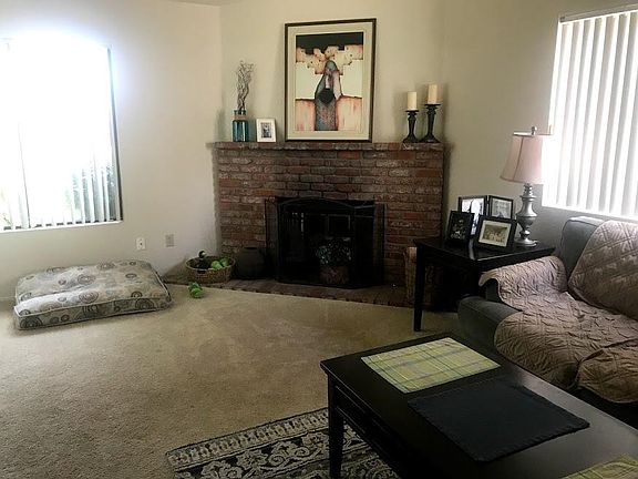 Beautiful brick fireplace adds coziness to the large space