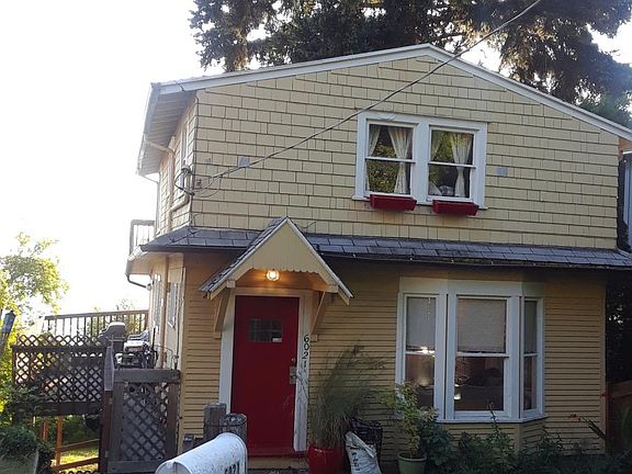 Charming 1920s beach cabin style home. 2 floors shown here are available to rent. Leased studio is down the stairs to the right.