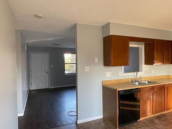 Kitchen with front door in background
