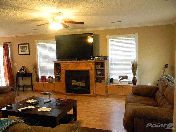 Family room - note wood enclosure with storage for gas firep