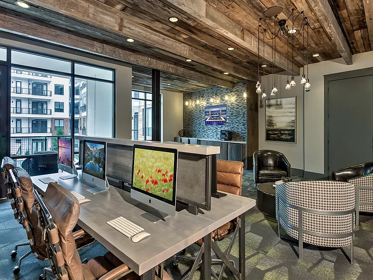 The business center with PCs, Macs, and a printer.