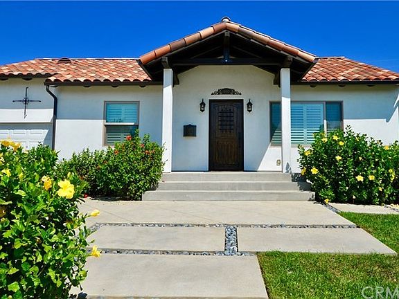 50 YEAR WARRANTY CLAY TILE ROOF,  WROUGHT IRON DETAILS AND HARDWOOD DOOR ADD CHARACTER AND CHARM.
