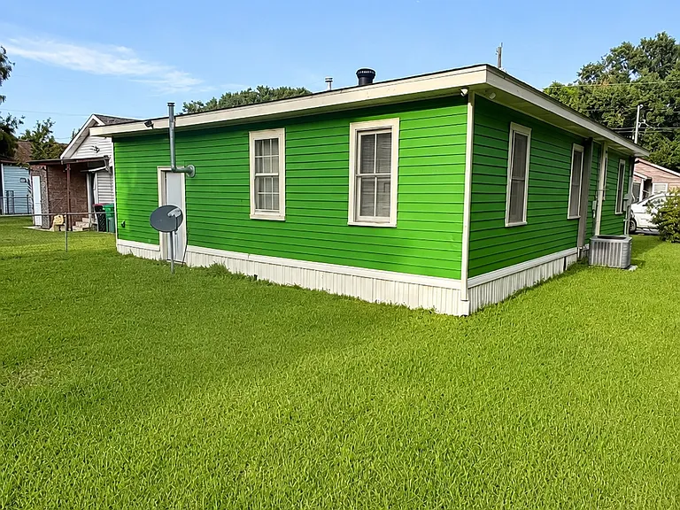 Side Exterior View highlighting the attractive exterior and generous lot.